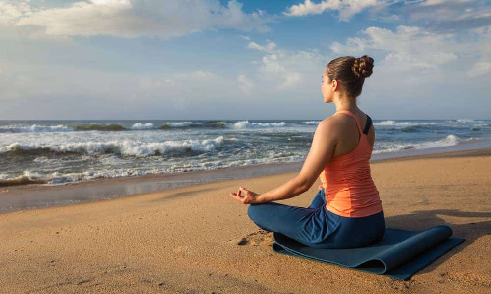 Why does yoga help relieve nausea?